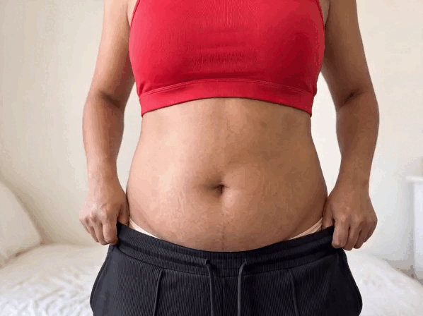 Bare tummy, then the plum brief pulled up over it